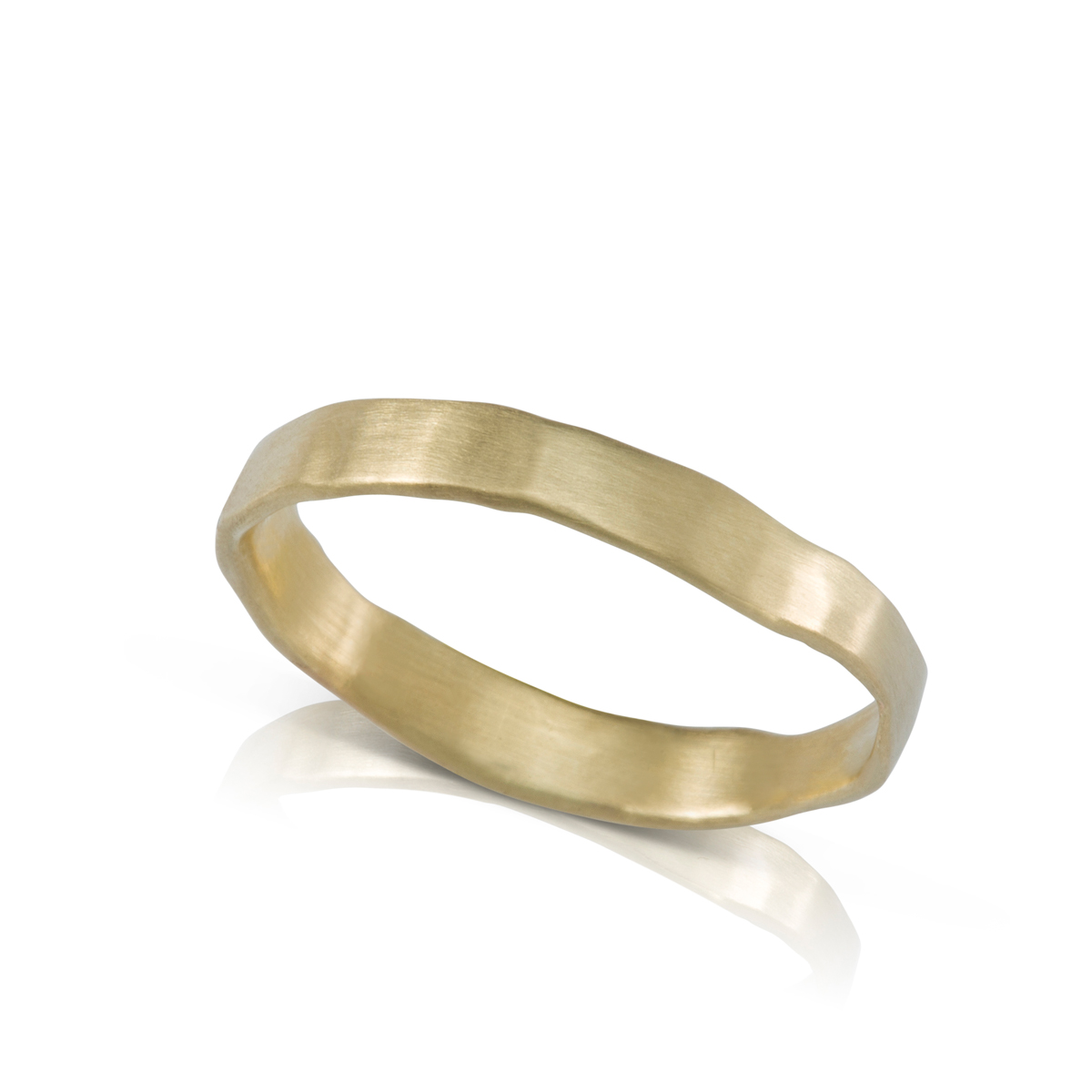 A gold ring in an asymmetrical handmade style