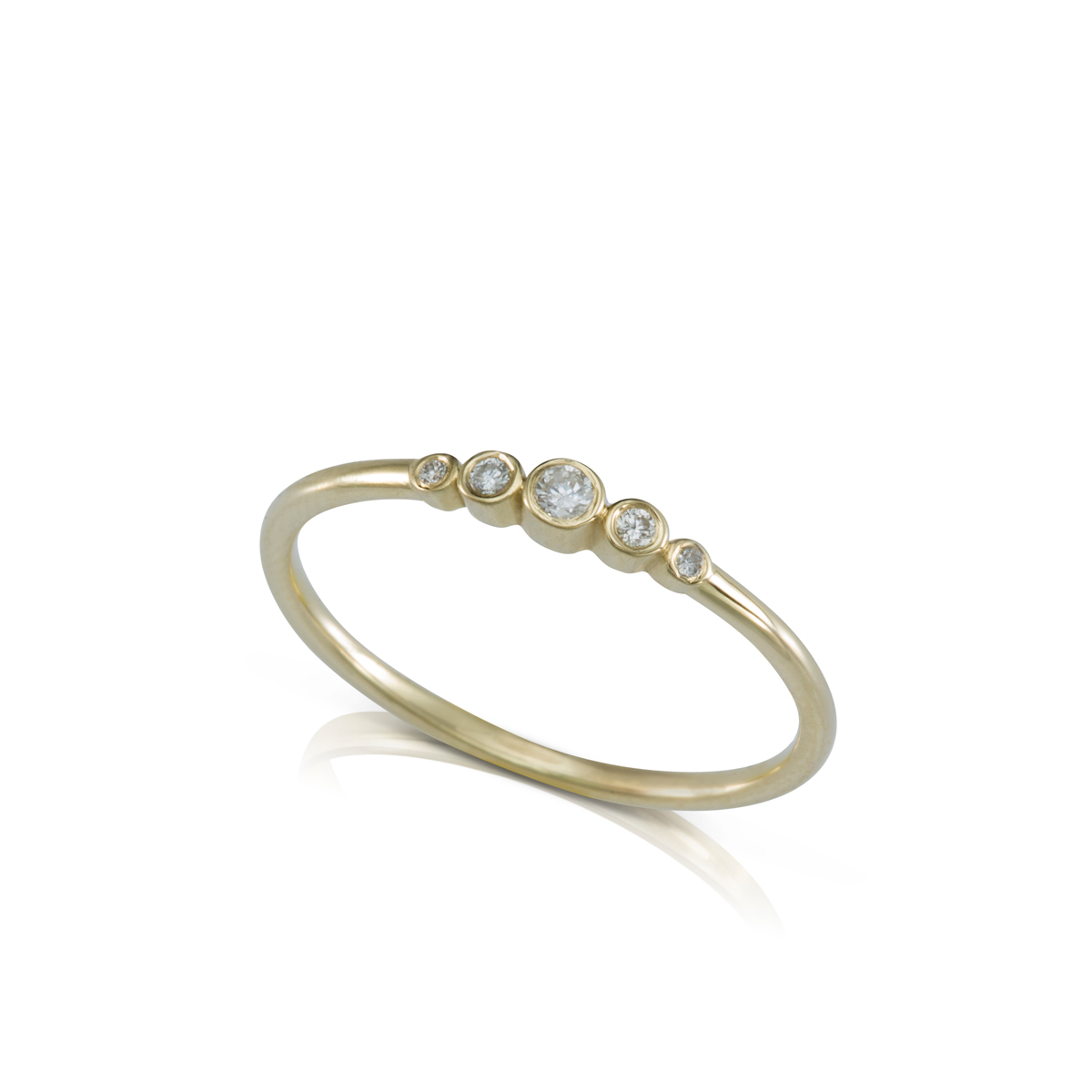 A delicate gold ring set with 5 diamonds