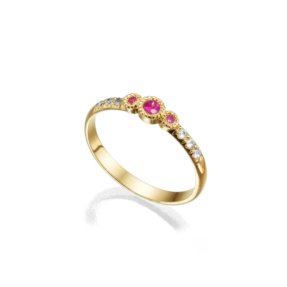 A gold ring set with three rubies and diamonds