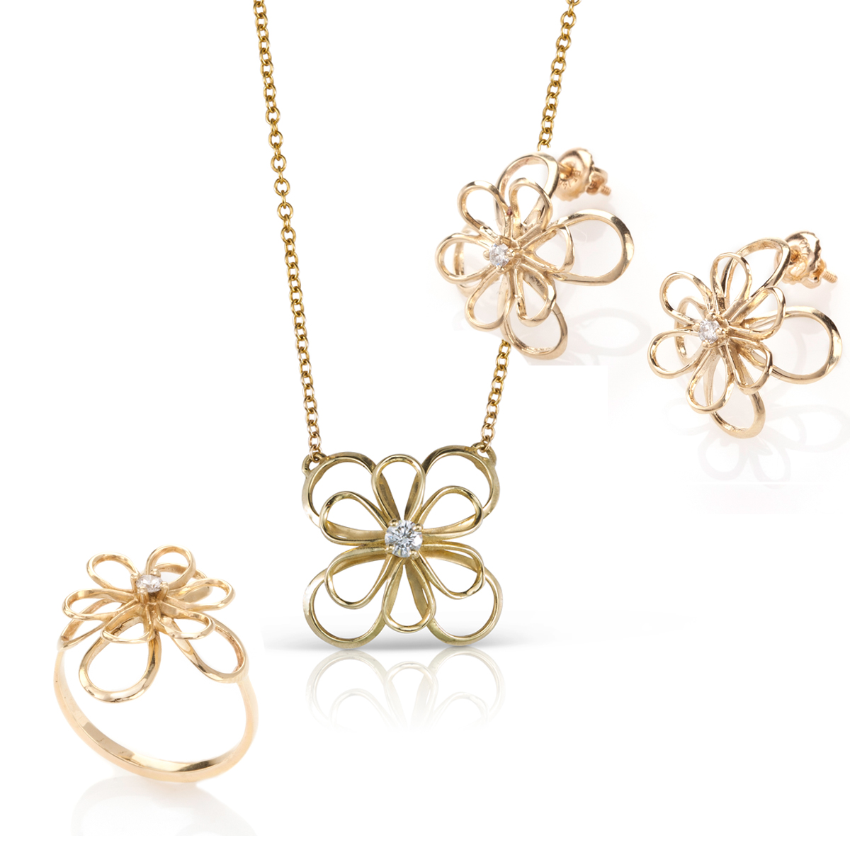 A set of gold jewelry in the shape of a flower and diamonds