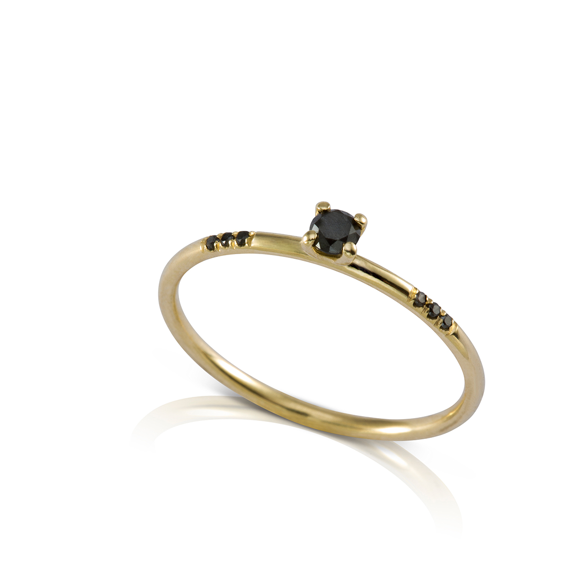 A delicate solitaire black diamond ring