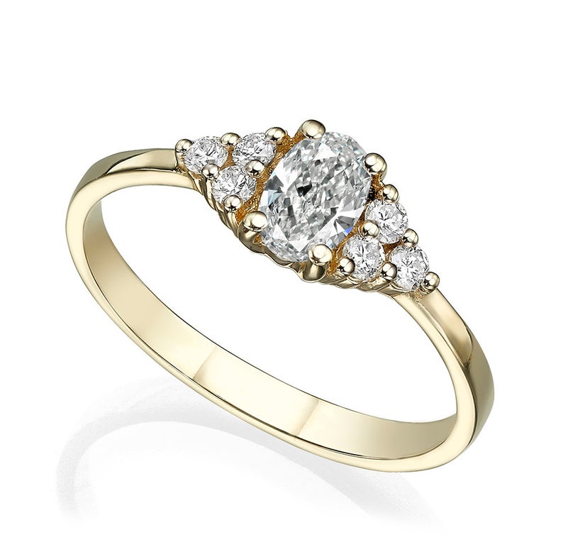 Center oval diamond with 3 round diamonds on each side total 0.58 Carat Engagement Ring