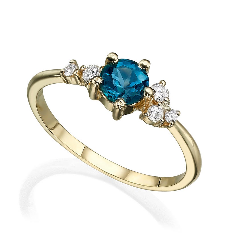 Asymmetrical London blue topaz and diamonds engagement ring